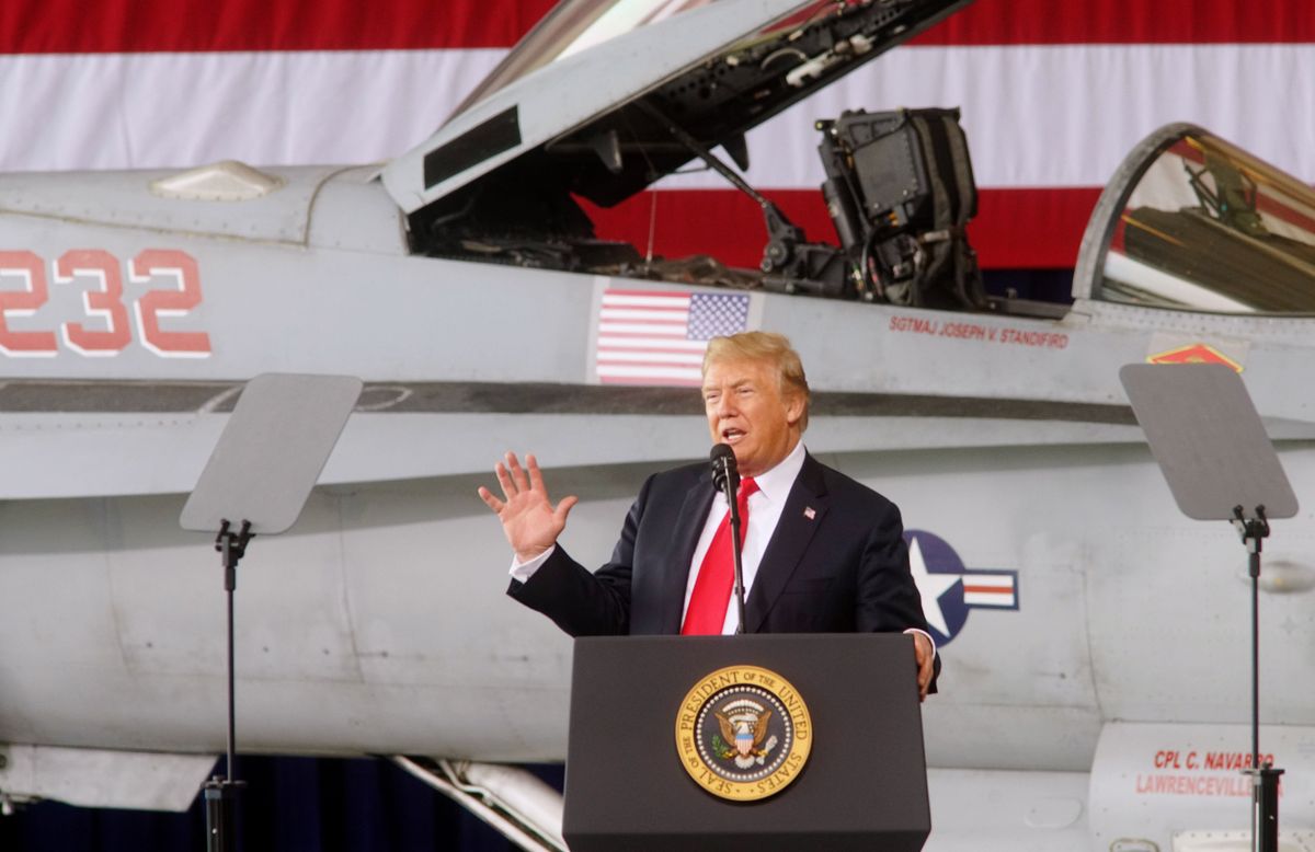 President Donald Trump, seen here explaining the plot of the 1993 film “Rising Sun” to a bunch of divorced car dealers.