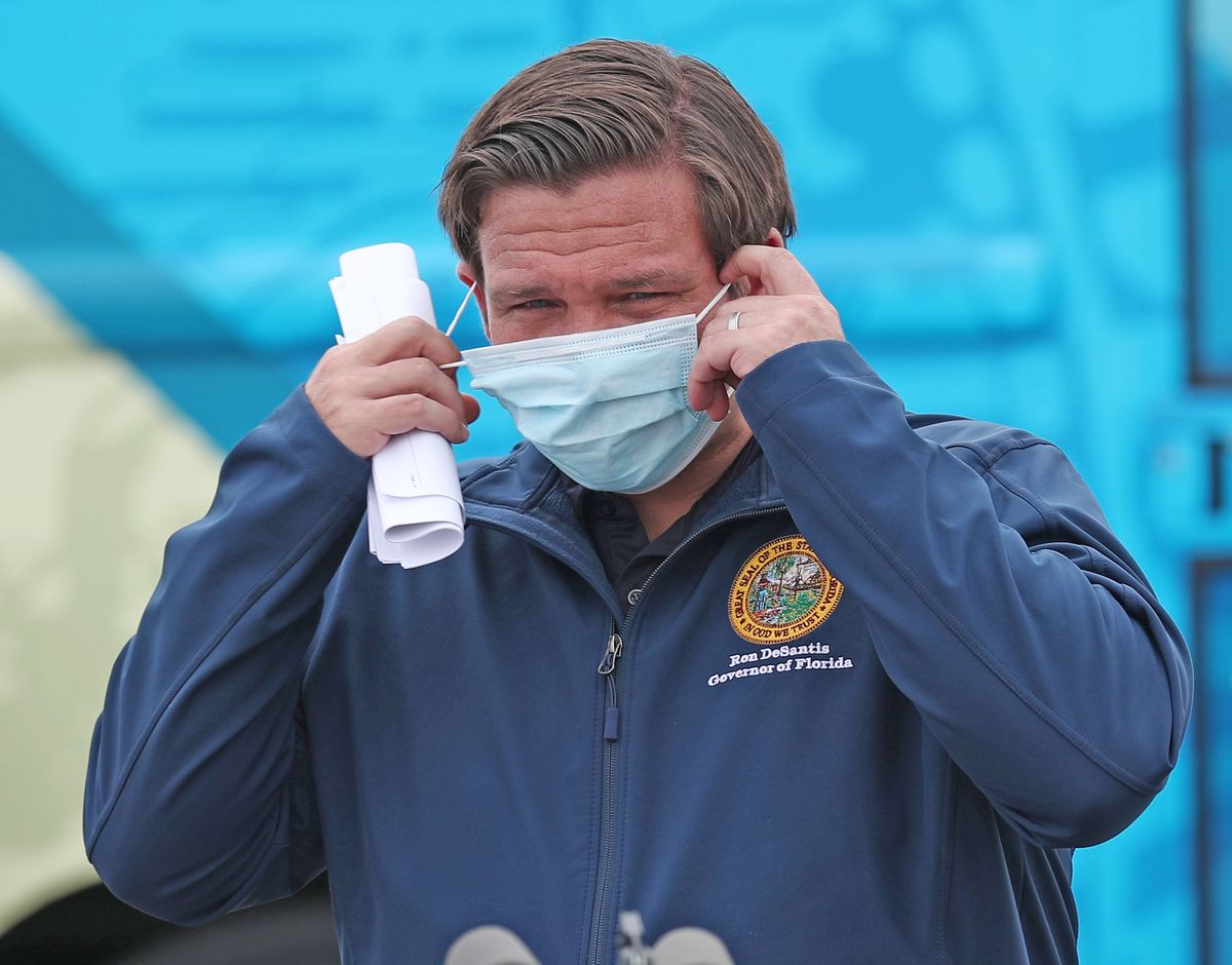Florida Governor Ron DeSantis, seen here last week wearing a mask before speaking with the media, says his state will house any sports team that needs home during this COVID-19 pandemic.