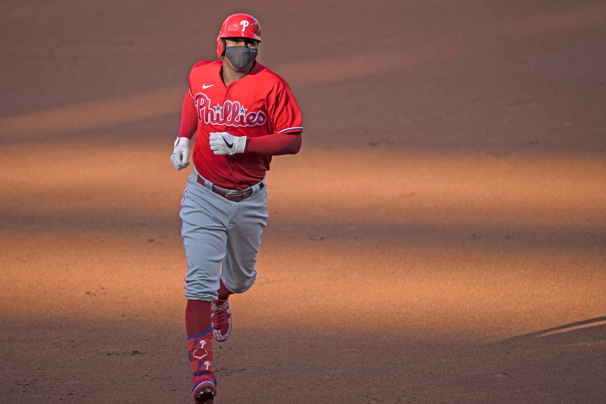 New Phillie Didi Gregorius rounds the bases wearing a mask after homering off Max Scherzer Saturday.