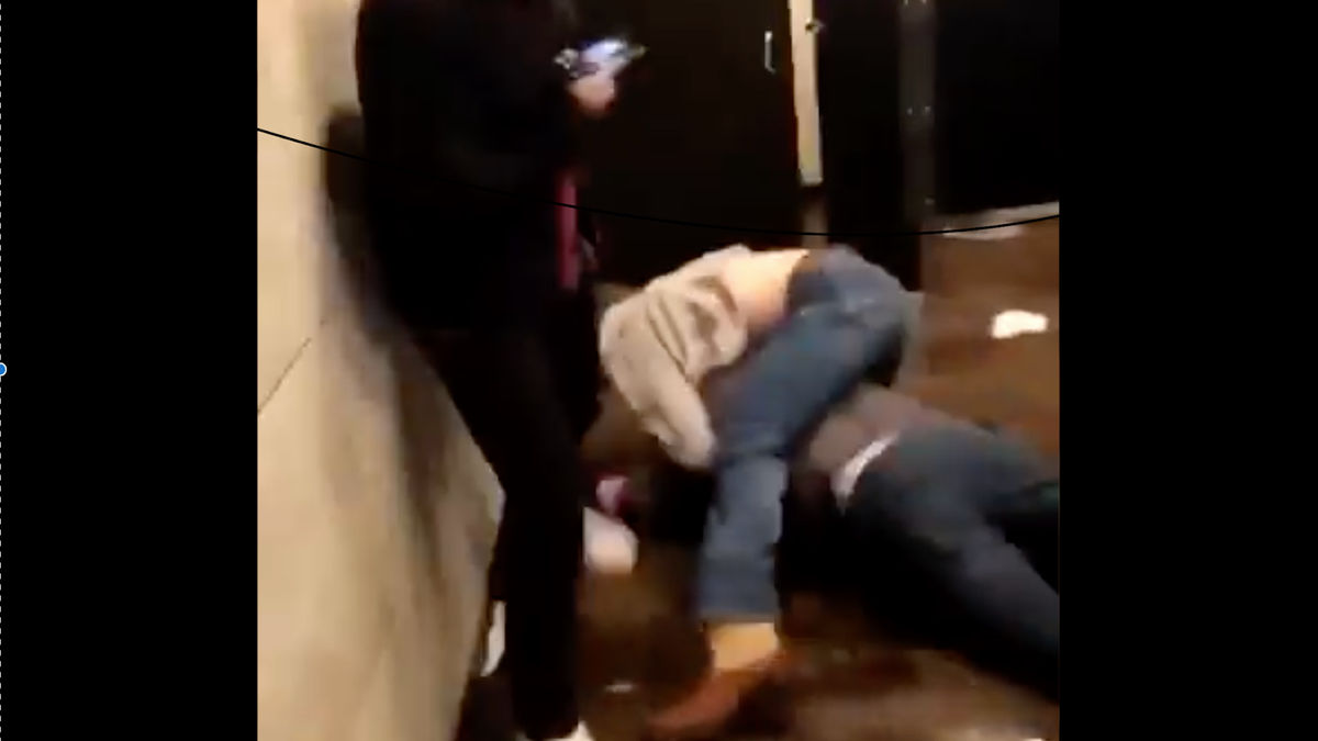 “That shit’s funny, bro,” an onlooker says as a man pummels Sooners wideout Spencer Jones in a bathroom.