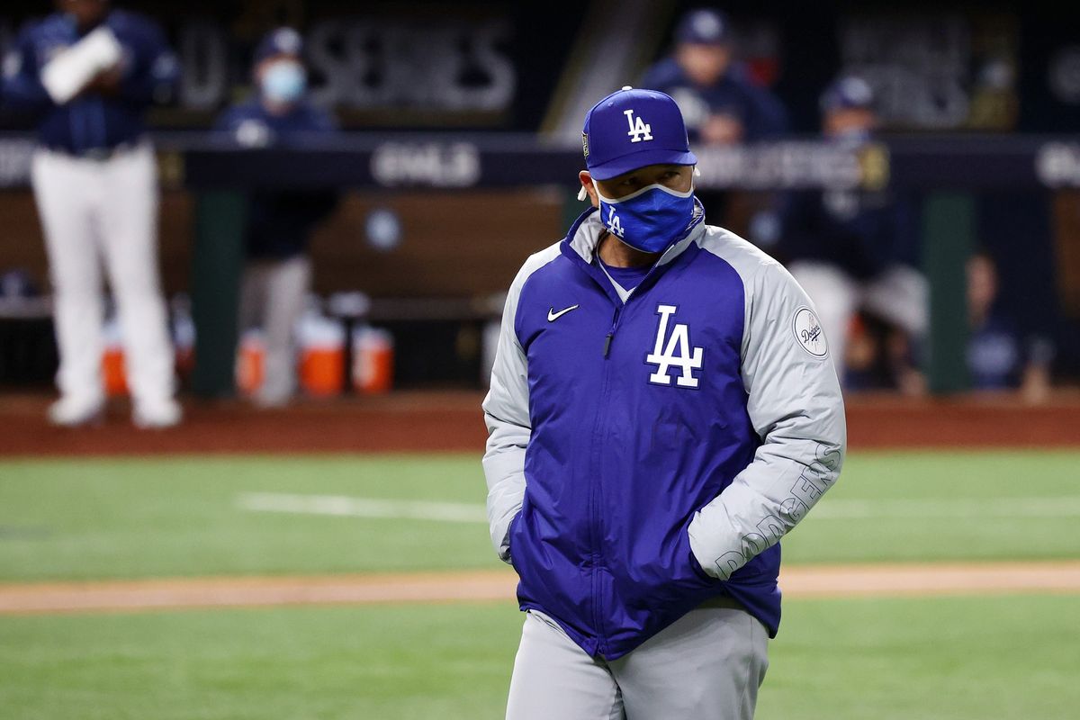 Dave Roberts walks back to the dugout after making a pitching change against the Tampa Bay Rays during the 5th inning.