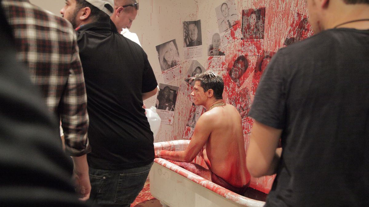 Milo Yiannopoulos in a bathtub full of pig’s blood