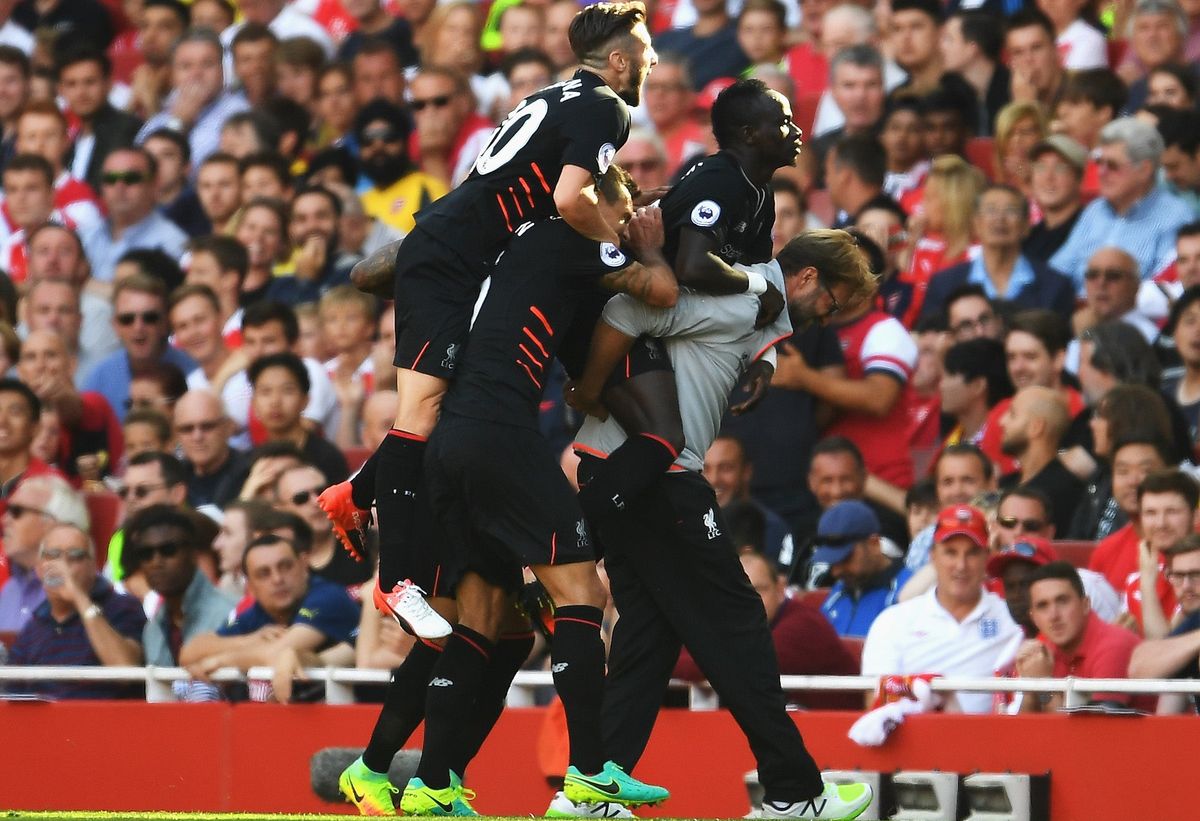 Liverpool celebrate one of their many goals against Arsenal. (Photo credit: Mike Hewitt/ [object Object] )