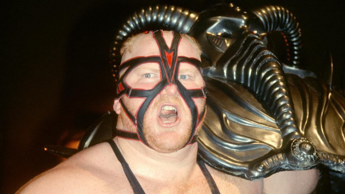 Big Van Vader carrying his amazing helmet.