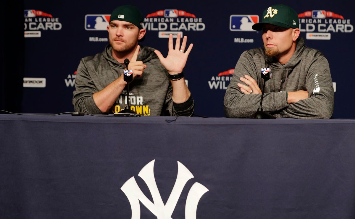Liam Hendriks and Blake Treinen. Hendriks is possibly attempting to count how many different pitchers the A’s will use over the first six innings.