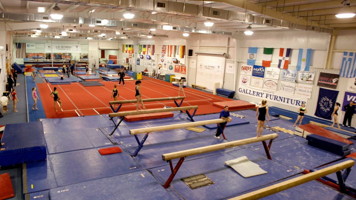 Gymnast workout with their personal coaches during a morning workout session at Karolyi Ranch in Texas in 2011.