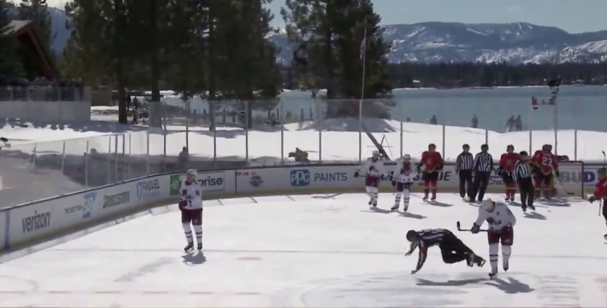 With ice meting under their skates, players and refs had a hard time staying upright.