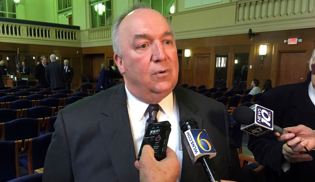 Engler addressing reporters last month.