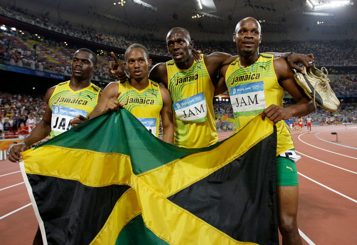 L-R: Nesta Carter, Michael Frater, Usain Bolt, and Asafa Powell. Photo by David J. Phillip/AP Images