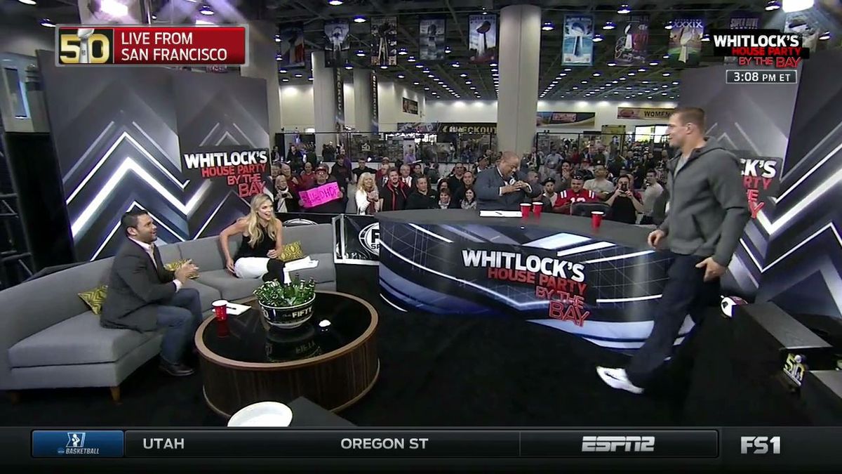 McIntyre (far left) claps as Rob Gronkowski prepares to  [object Object] .