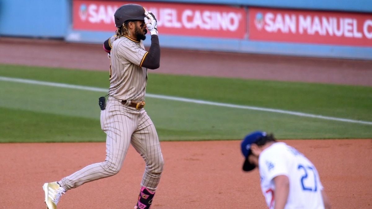 Fernando Tatis Jr. covers one eye with his hand while rounding the bases after homering off Trevor Bauer on Saturday.