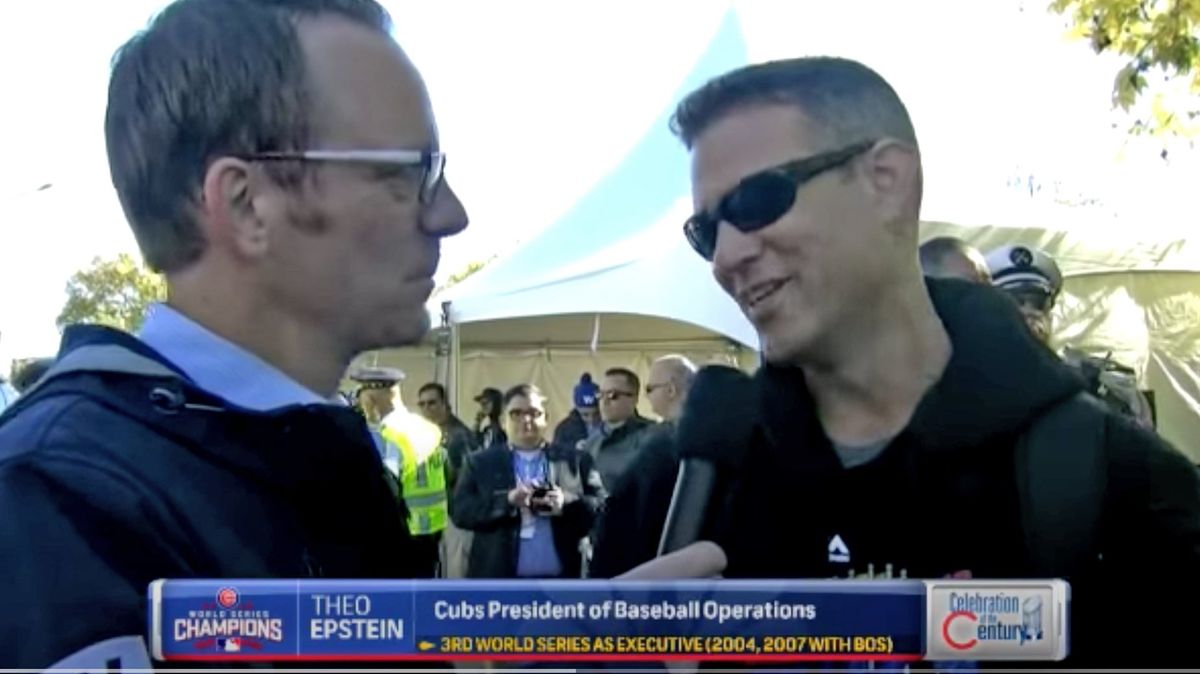 Len Kasper, left, interviews Theo Epstein at Cubs’ World Series parade in 2016.