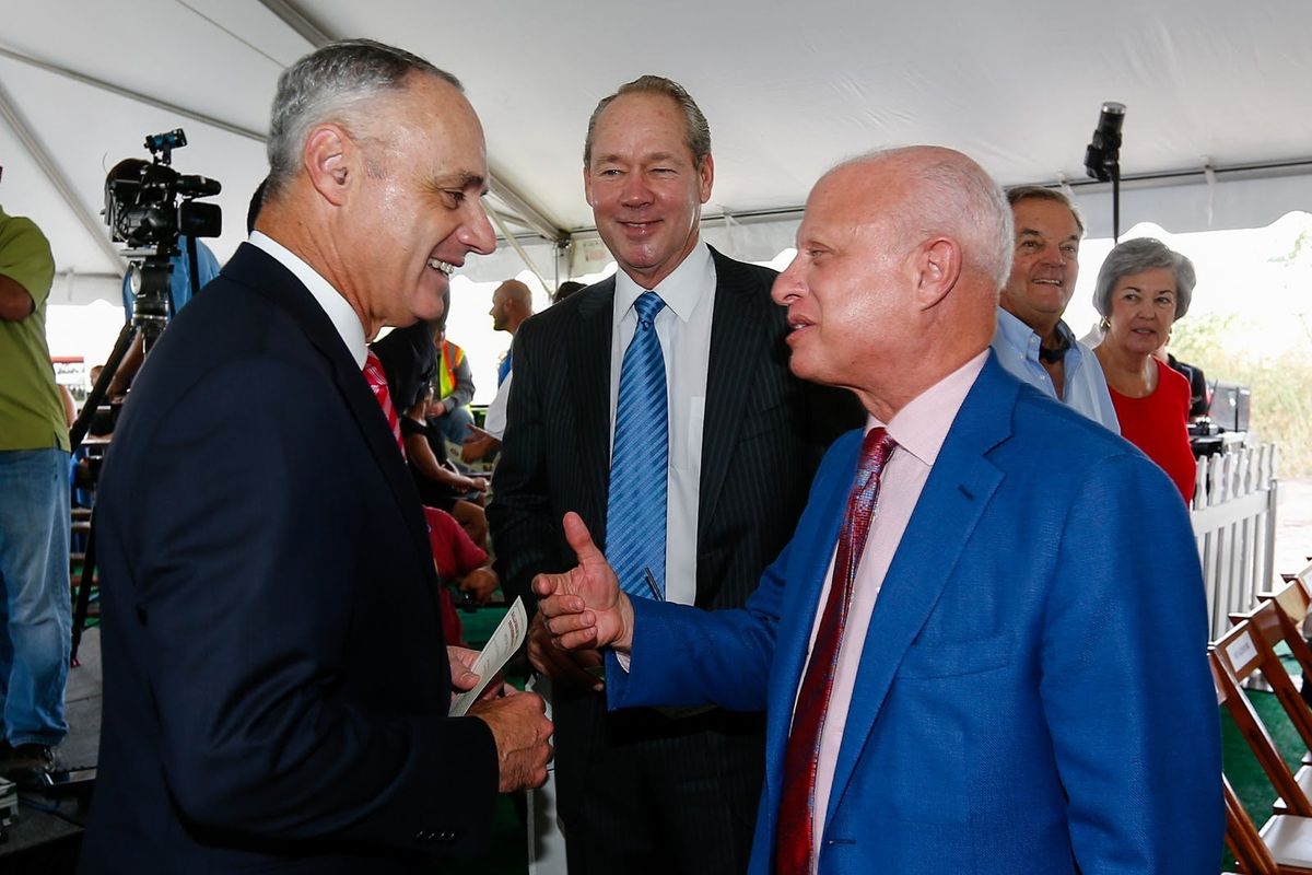 Commissioner Rob Manfred, left, Houston Astros owner Jim Crane, center, Washington Nationals owner Mark Lerner and their cohorts have a sudden interest in prioritizi ng COVID-19 safety. Sure.