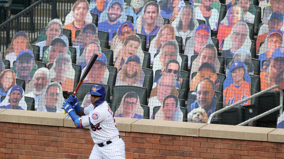 Yoenis Cespedes stands in the on-deck circle during a Mets exhibition game, as MLB prepares for a season unlike any other.