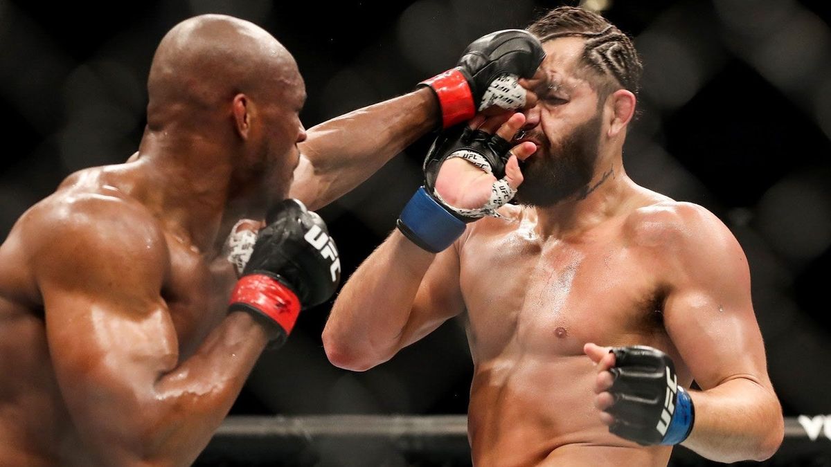 Kamaru Usman of Nigeria punches Jorge Masvidal of the United States during the Welterweight Title bout of UFC 261 at VyStar Veterans Memorial Arena on April 25, 2021 in Jacksonville, Florida.