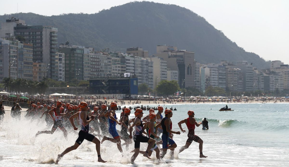 Triathletes enter the water during the Rio Olympics. Photo credit: Bryn Lennon/ [object Object]