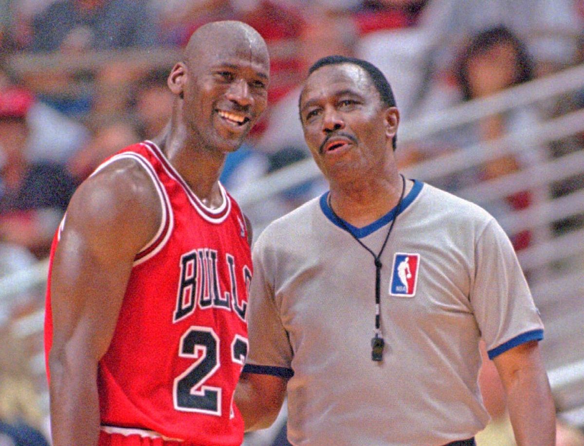 Michael Jordan and referee Hue Hollins, who made the call against Scottie Pippen that helped kill the Bulls’ 93-94 season.
