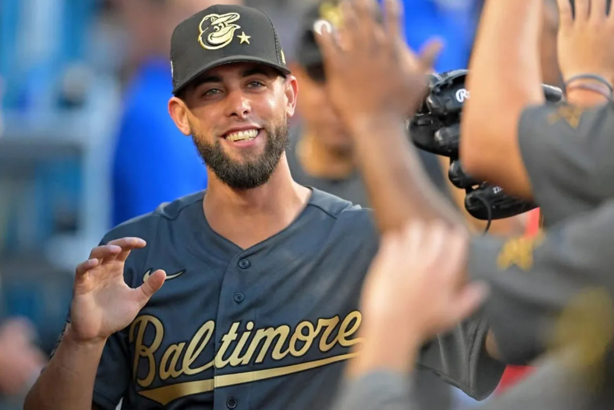 Jul 19, 2022; Los Angeles, California, USA; American League relief pitcher Jorge Lopez (48) of the Baltimore Orioles smiles as he gets high fives in the dugout after pitching against the National League during the seventh inning of the 2022 MLB All Star Game at Dodger Stadium. credits: Jayne Kamin-Oncea-USA TODAY Sports