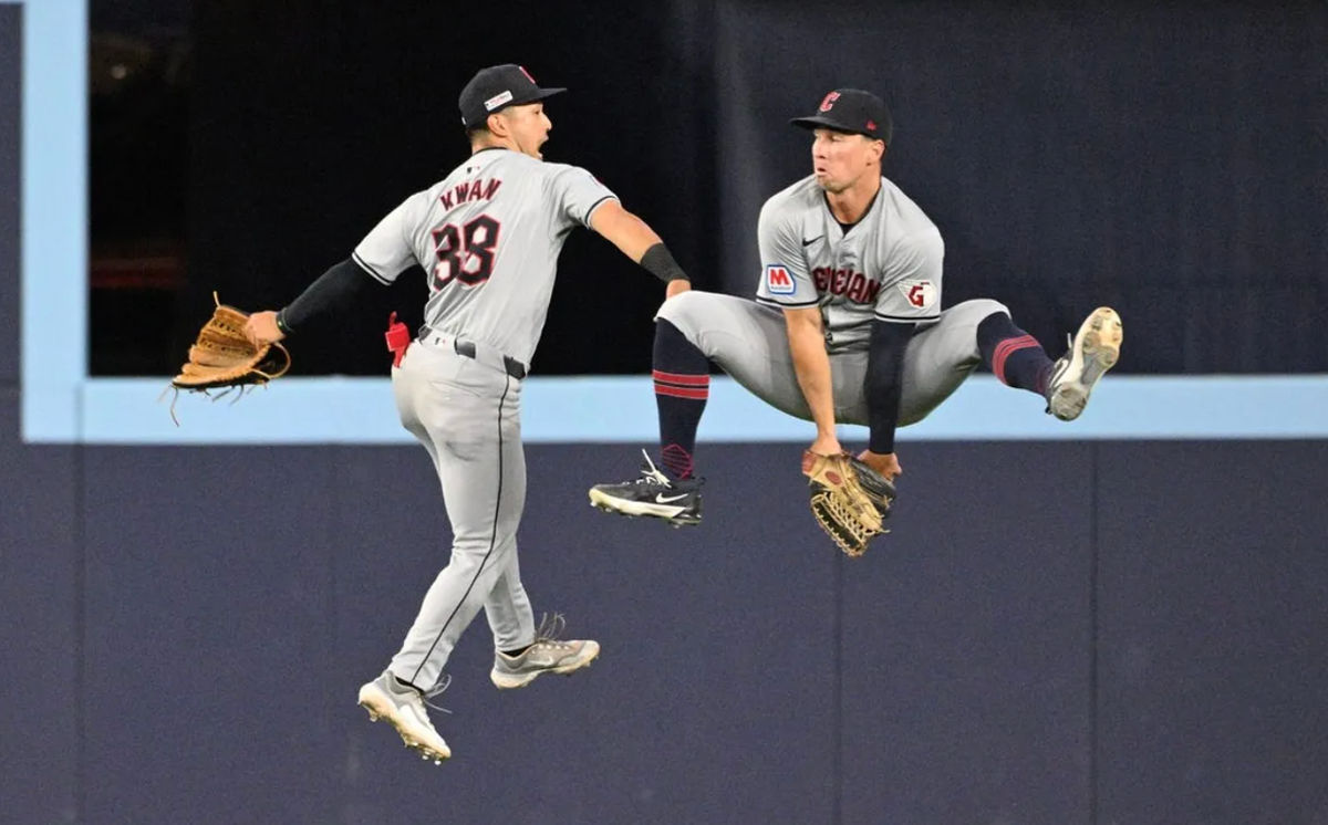 Jun 14, 2024; Toronto, Ontario, CAN; Cleveland Guardians left fielder Steven Kwan (38) and right fielder Will Brennan (17) celebrate after a win over the Toronto Blue Jays at Rogers Centre. Mandatory Credit: Dan Hamilton-USA TODAY Sports