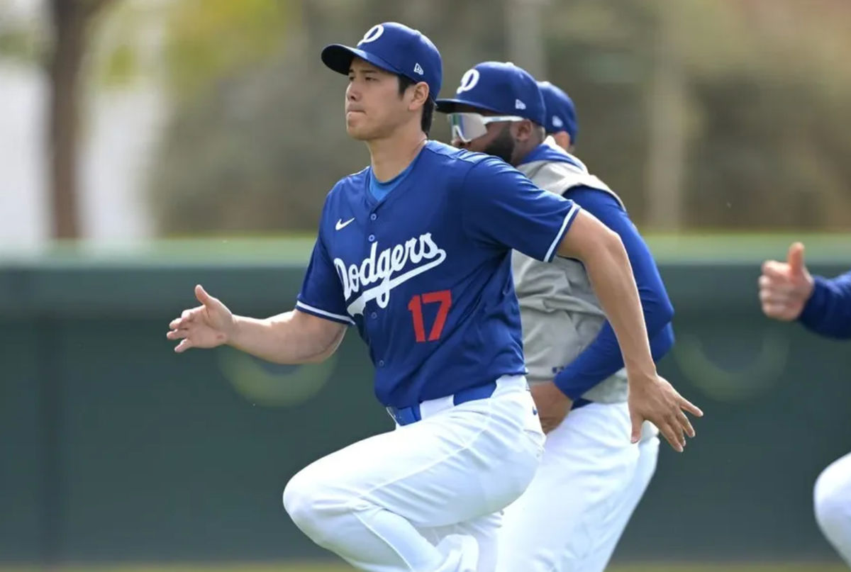 Feb 18, 2024; Glendale, AZ, USA; Los Angeles Dodgers designated hitter Shohei Ohtani (17) stretches during spring training at Camelback Ranch. credits: Jayne Kamin-Oncea-USA TODAY Sports