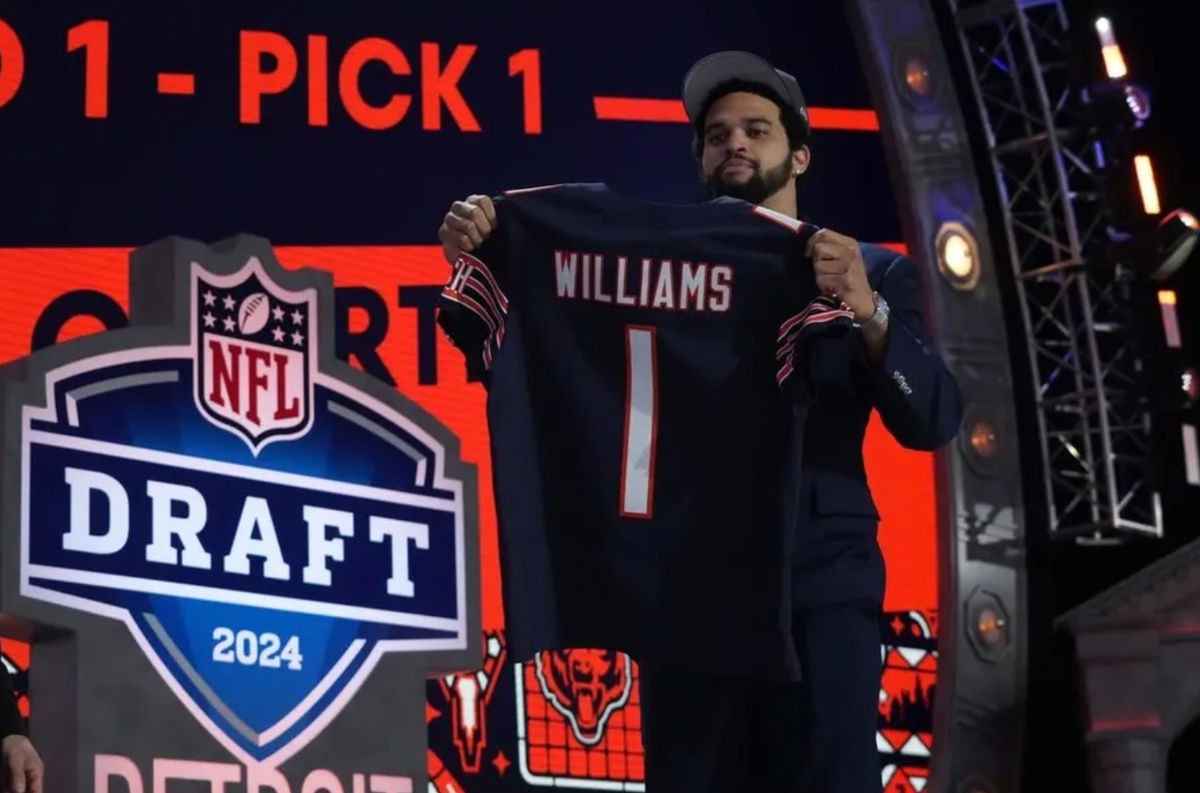 Apr 25, 2024; Detroit, MI, USA; Southern California Trojans quarterback Caleb Williams poses with jersey after being chosen as the No. 1 pick in the first round during the 2024 NFL Draft at Campus Martius Park and Hart Plaza. credits: Kirby Lee-USA TODAY Sports