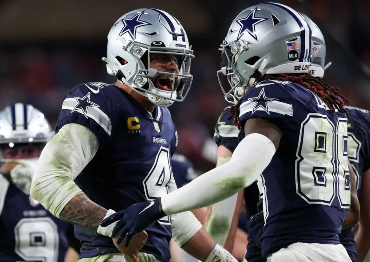 Jan 16, 2023; Tampa, Florida, USA; Dallas Cowboys quarterback Dak Prescott (4) reacts with wide receiver CeeDee Lamb (88) after throwing a touchdown pass against the Tampa Bay Buccaneers in the second half during the wild card game at Raymond James Stadium. Mandatory Credit: Kim Klement-USA TODAY Sports
