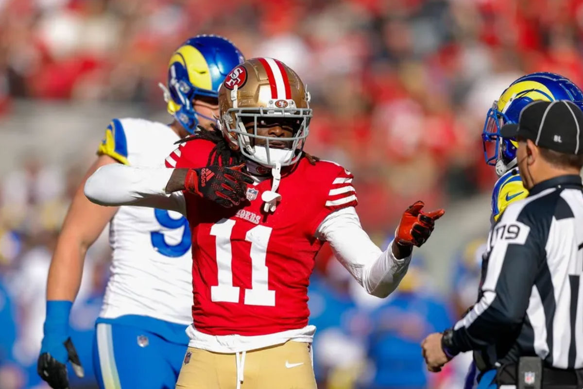 7 de enero de 2024; Santa Clara, California, EE. UU.; El receptor abierto de los San Francisco 49ers, Brandon Aiyuk (11), celebra después de una jugada contra Los Angeles Rams durante el primer cuarto en el Levi's Stadium. Crédito obligatorio: Sergio Estrada-USA TODAY Sports