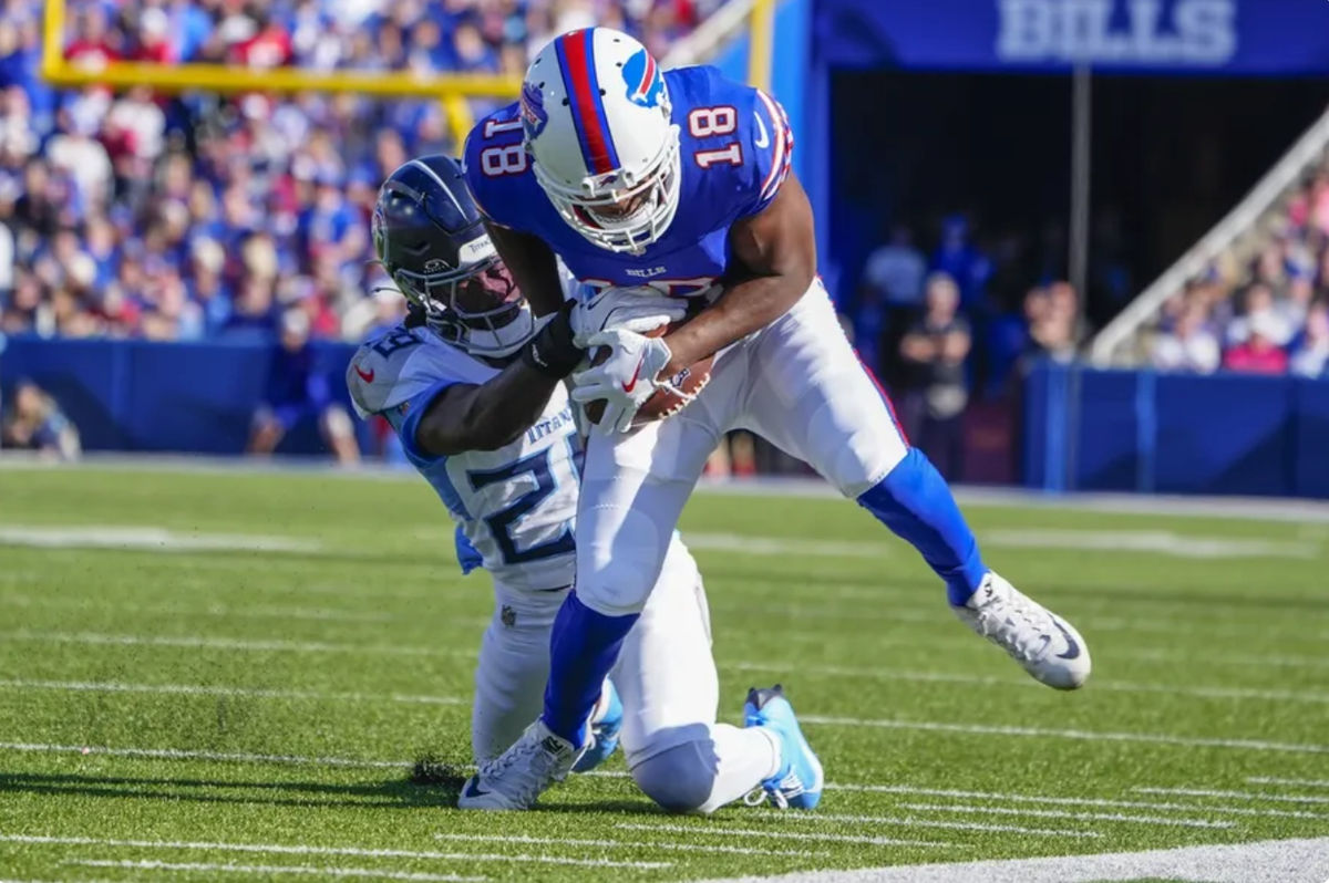 Oct 20, 2024; Orchard Park, New York, USA; Tennessee Titans cornerback Jarvis Brownlee Jr. (29) tackles Buffalo Bills wide receiver Amari Cooper (18) after he made a catch during the second half at Highmark Stadium. Mandatory Credit: Gregory Fisher-Imagn Images