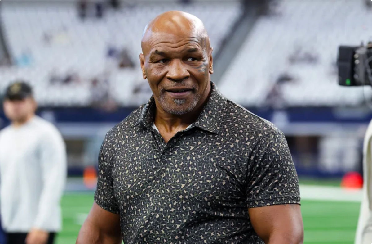 Sep 15, 2024; Arlington, Texas, USA; Boxer Mike Tyson on the field before the game between the Dallas Cowboys and New Orleans Saints at AT&amp;T Stadium. Mandatory Credit: Kevin Jairaj-Imagn Images