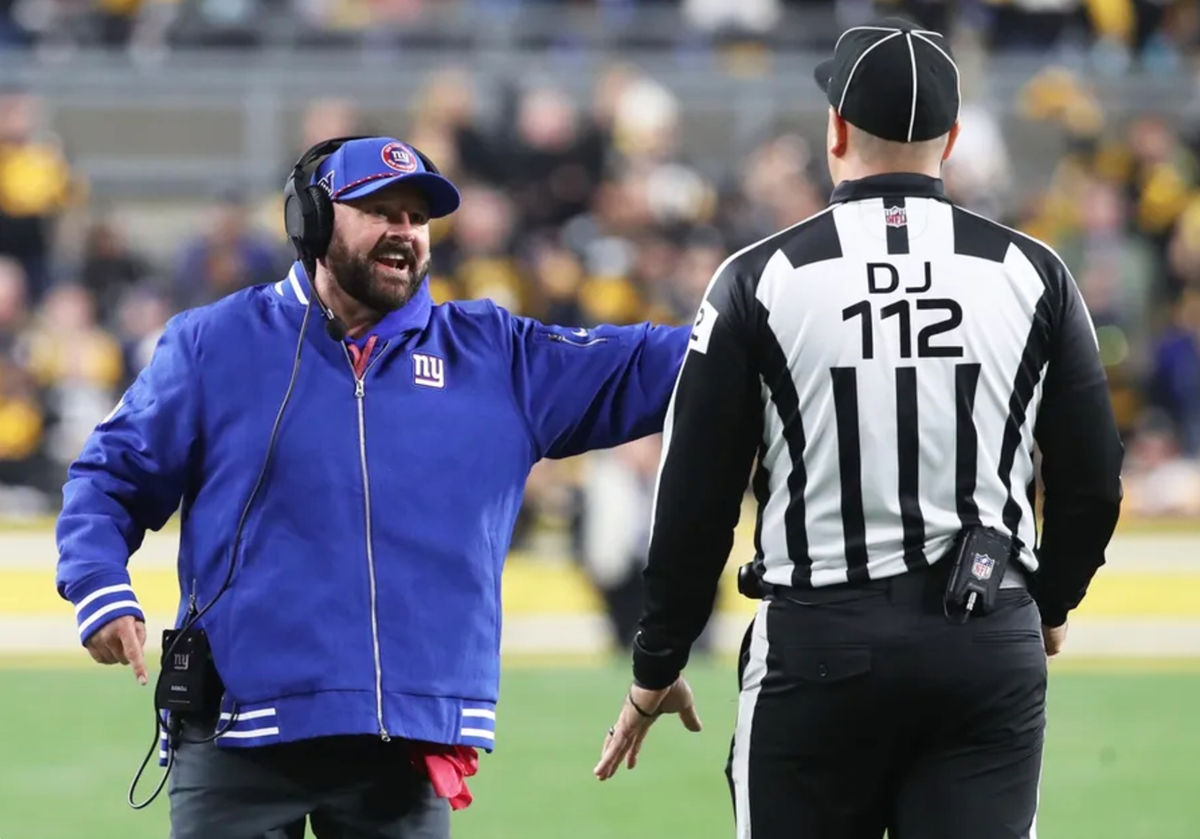 Oct 28, 2024; Pittsburgh, Pennsylvania, USA; New York Giants head coach Brian Daboll (left) reacts to down judge Brian Sakowski (112) against the Pittsburgh Steelers during the second quarter at Acrisure Stadium. Mandatory Credit: Charles LeClaire-Imagn Images