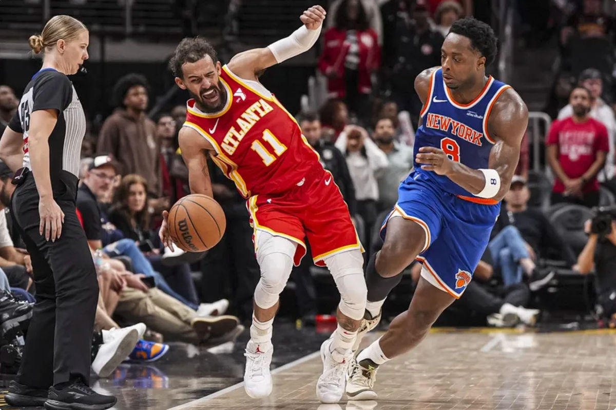 Nov 6, 2024; Atlanta, Georgia, USA; Atlanta Hawks guard Trae Young (11) is sent out of bounds by New York Knicks forward OG Anunoby (8) during the second half at State Farm Arena. Mandatory Credit: Dale Zanine-Imagn Images