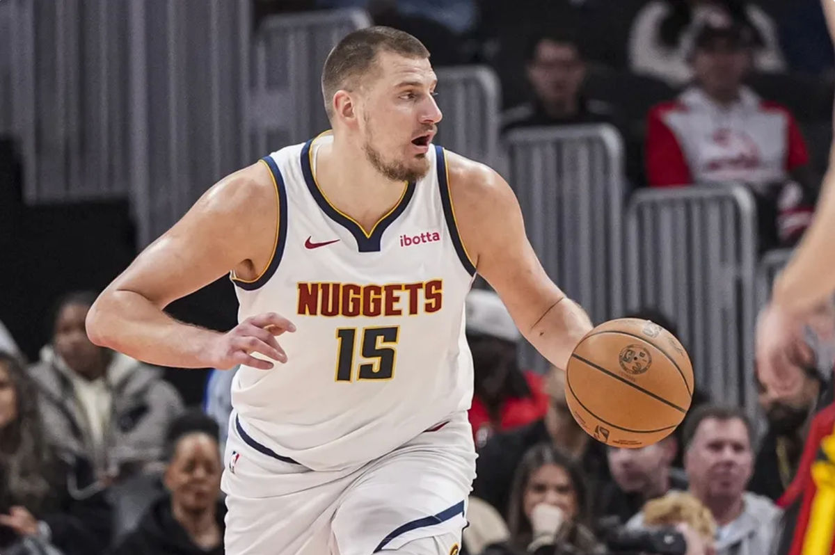 Dec 8, 2024; Atlanta, Georgia, USA; Denver Nuggets center Nikola Jokic (15) controls the ball against the Atlanta Hawks during the first half at State Farm Arena. Mandatory Credit: Dale Zanine-Imagn Images