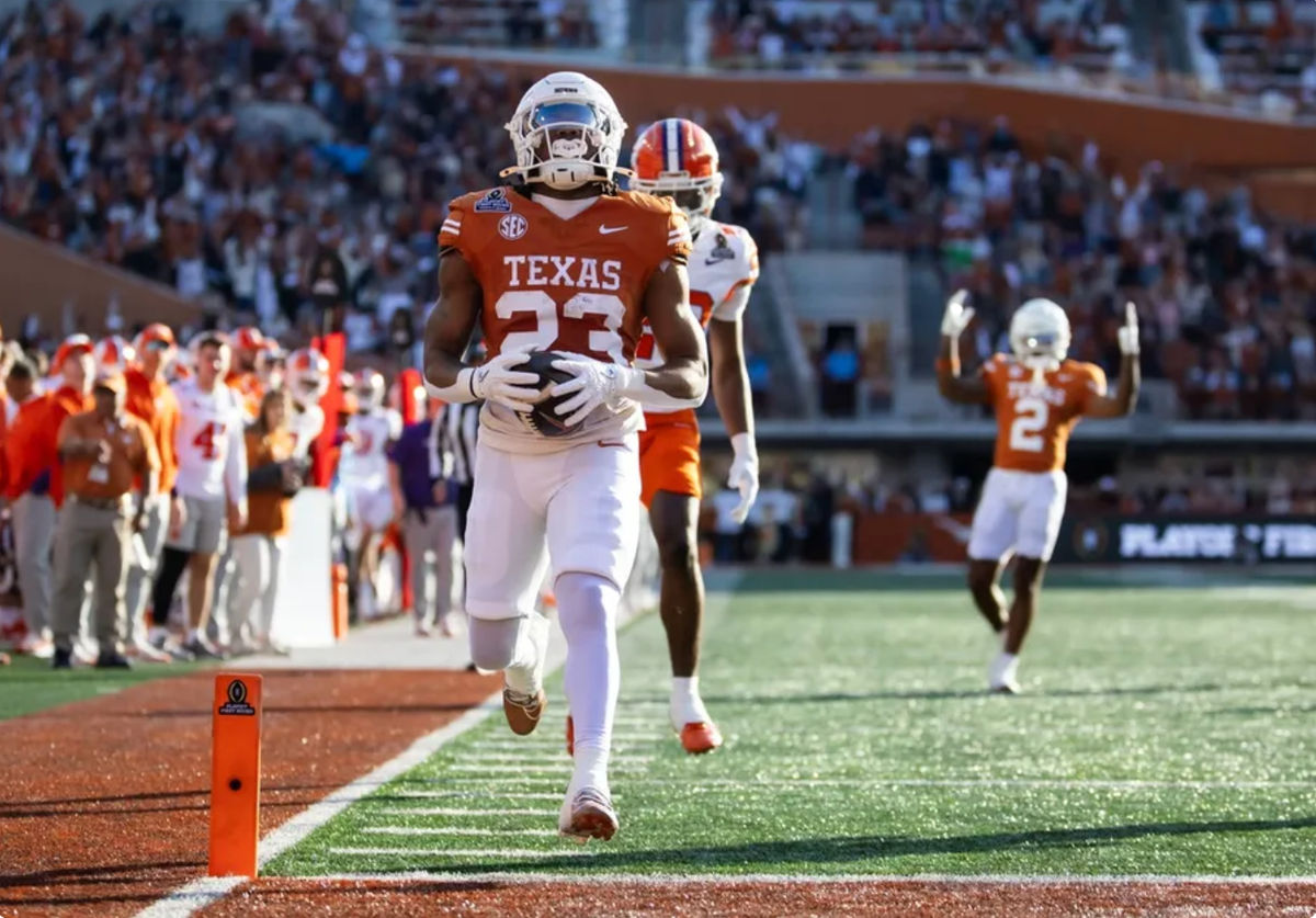 Dec 21, 2024; Austin, Texas, USA; Texas Longhorns running back Jaydon Blue (23) scores a touchdown against the Clemson Tigers during the first half of the CFP National playoff first round at Darrell K Royal-Texas Memorial Stadium. Mandatory Credit: Mark J. Rebilas-Imagn Imagesn Images