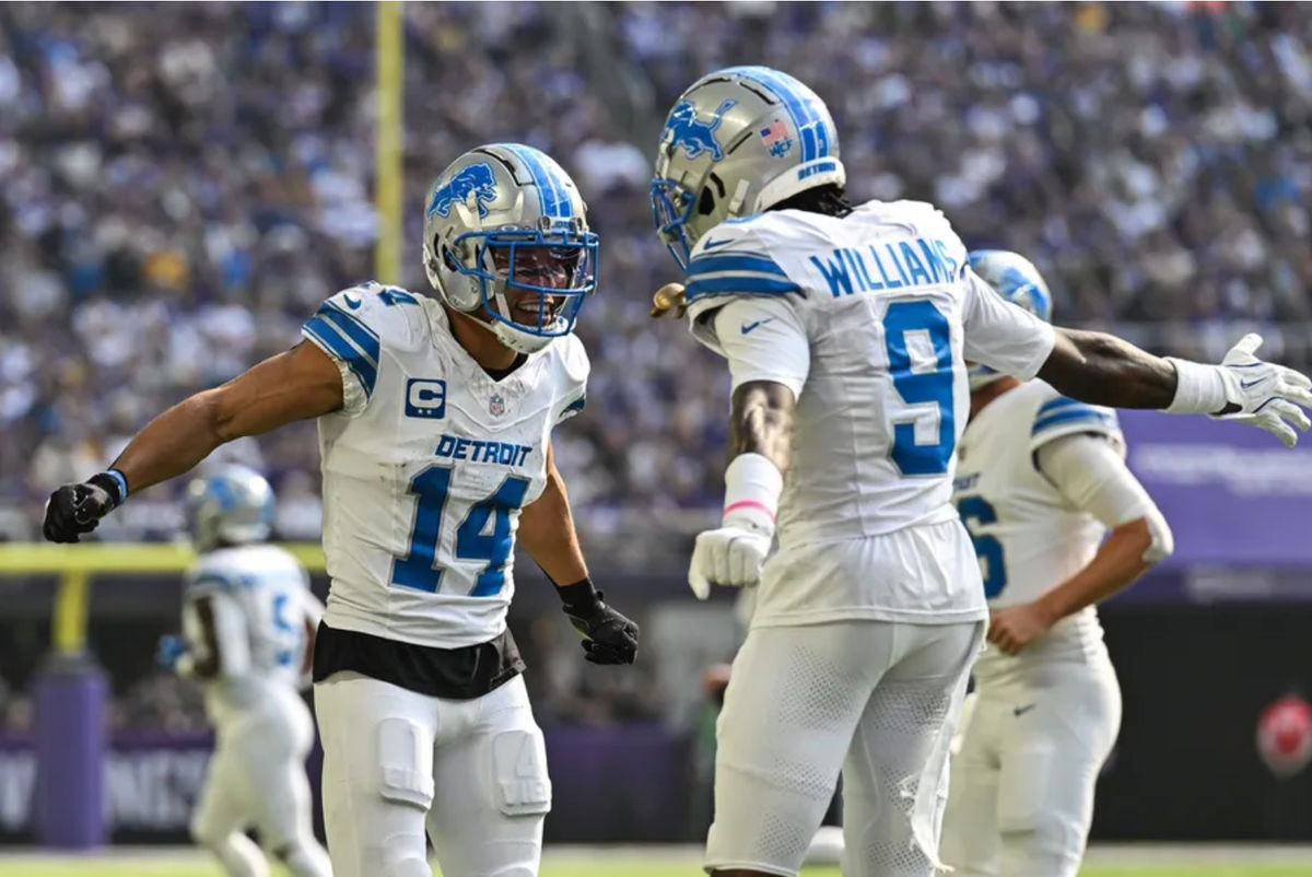 Oct 20, 2024; Minneapolis, Minnesota, USA; Detroit Lions wide receiver Amon-Ra St. Brown (14) reacts with wide receiver Jameson Williams (9) after catching a 35 yard touchdown pass from quarterback Jared Goff (not pictured) against the Minnesota Vikings the second quarter at U.S. Bank Stadium. Mandatory Credit: Jeffrey Becker-Imagn Images