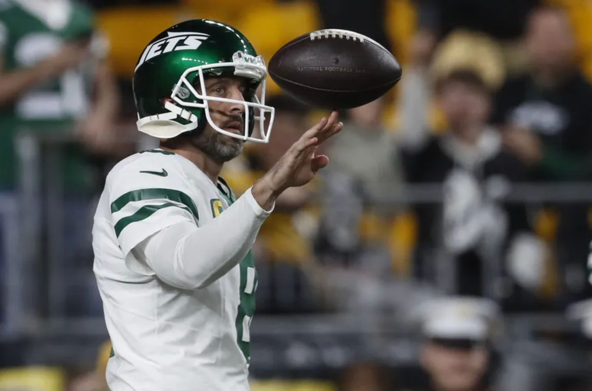 Oct 20, 2024; Pittsburgh, Pennsylvania, USA; New York Jets quarterback Aaron Rodgers (8) warms up before the game against the Pittsburgh Steelers at Acrisure Stadium. Mandatory Credit: Charles LeClaire-Imagn Images