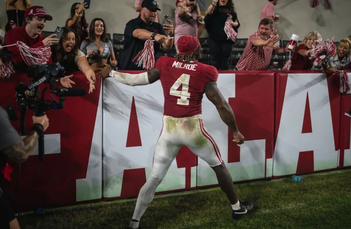 Sep 28, 2024; Tuscaloosa, Alabama, USA; Alabama Crimson Tide quarterback Jalen Milroe (4) celebrates with fans after the Alabama Crimson Tide victory against the Georgia Bulldogs at Bryant-Denny Stadium. Mandatory Credit: Will McLelland-Imagn Images