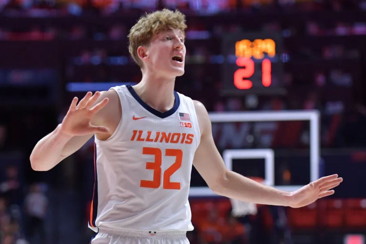 Nov 13, 2024; Champaign, Illinois, USA; Illinois Fighting Illini guard Kasparas Jakucionis (32) reacts during the first half against the Oakland Golden Grizzlies at State Farm Center. Mandatory Credit: Ron Johnson-Imagn Images