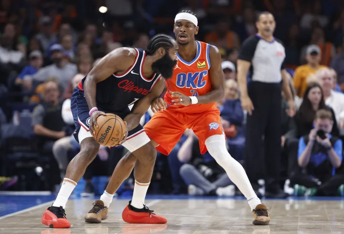 Nov 11, 2024; Oklahoma City, Oklahoma, USA; Oklahoma City Thunder guard Shai Gilgeous-Alexander (2) defends a drive by Los Angeles Clippers guard James Harden (1) during the second quarter at Paycom Center. Mandatory Credit: Alonzo Adams-Imagn Images