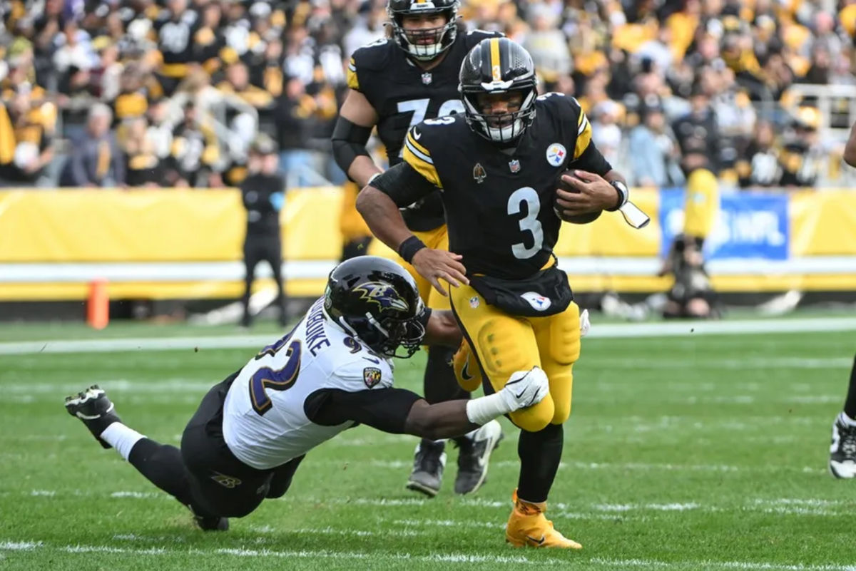 Nov 17, 2024; Pittsburgh, Pennsylvania, USA; Pittsburgh Steelers quarterback Russell Wilson (3) runs away from Baltimore Ravens defensive tackle Nnamdi Madubuike (92) during the second quarter at Acrisure Stadium. Mandatory Credit: Barry Reeger-Imagn Images