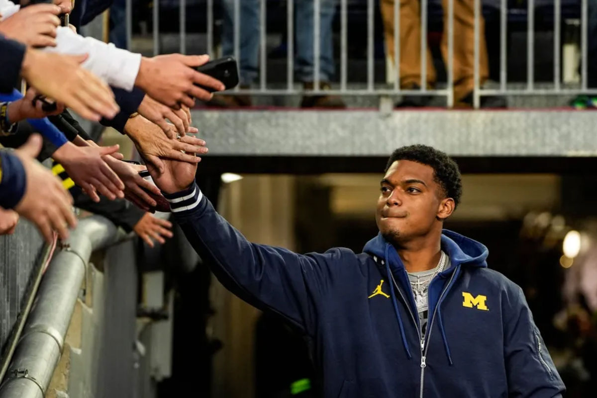 Michigan defensive back Will Johnson (2) high-fives fans during warm up before the Michigan State game at Michigan Stadium in Ann Arbor on Saturday, Oct. 26, 2024. PHOTO USA TODAY SPORTS IMAGES