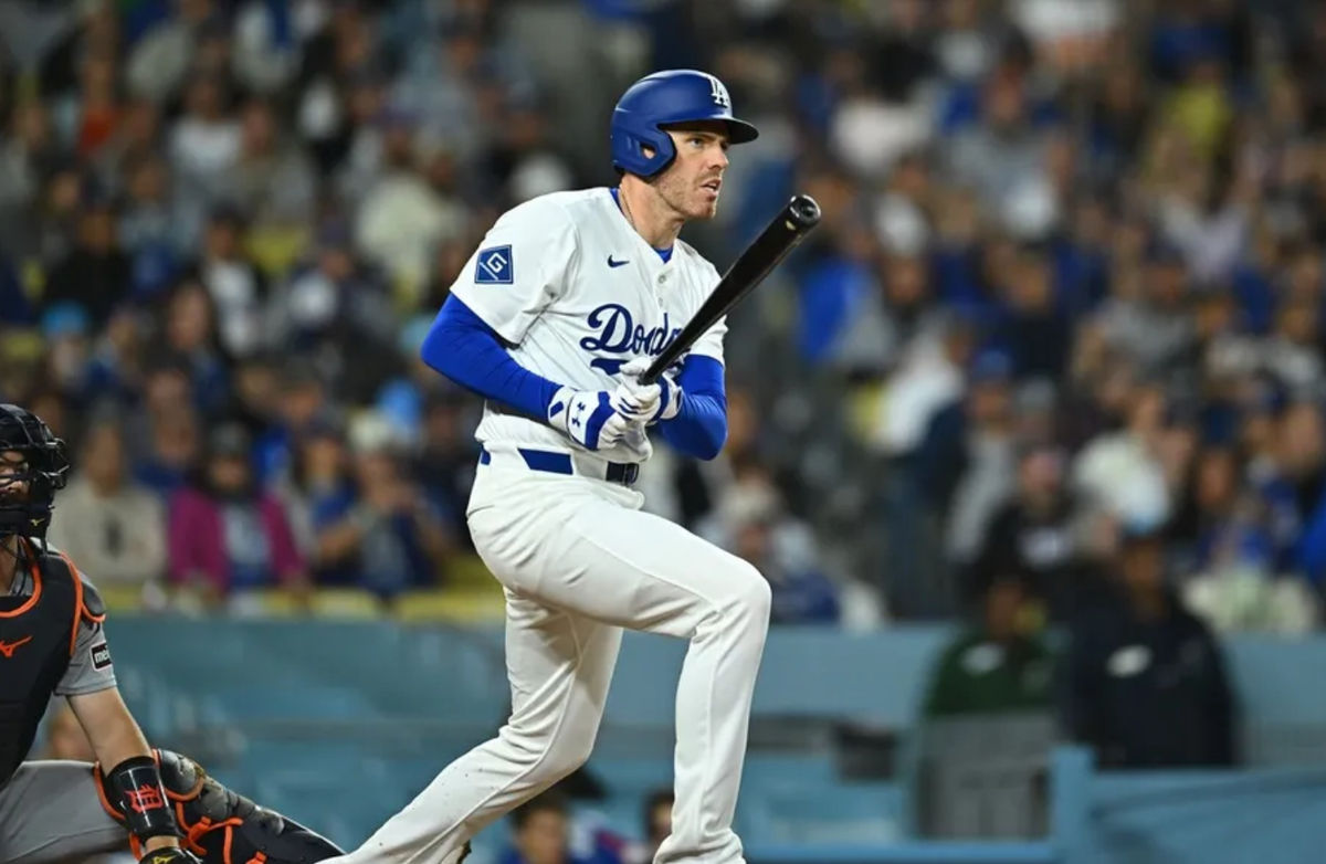 Mar 29, 2025; Los Angeles, California, USA; Los Angeles Dodgers first baseman Freddie Freeman (5) hits a double in the seventh inning against the Detroit Tigers at Dodger Stadium. Mandatory Credit: Jonathan Hui-Imagn Images