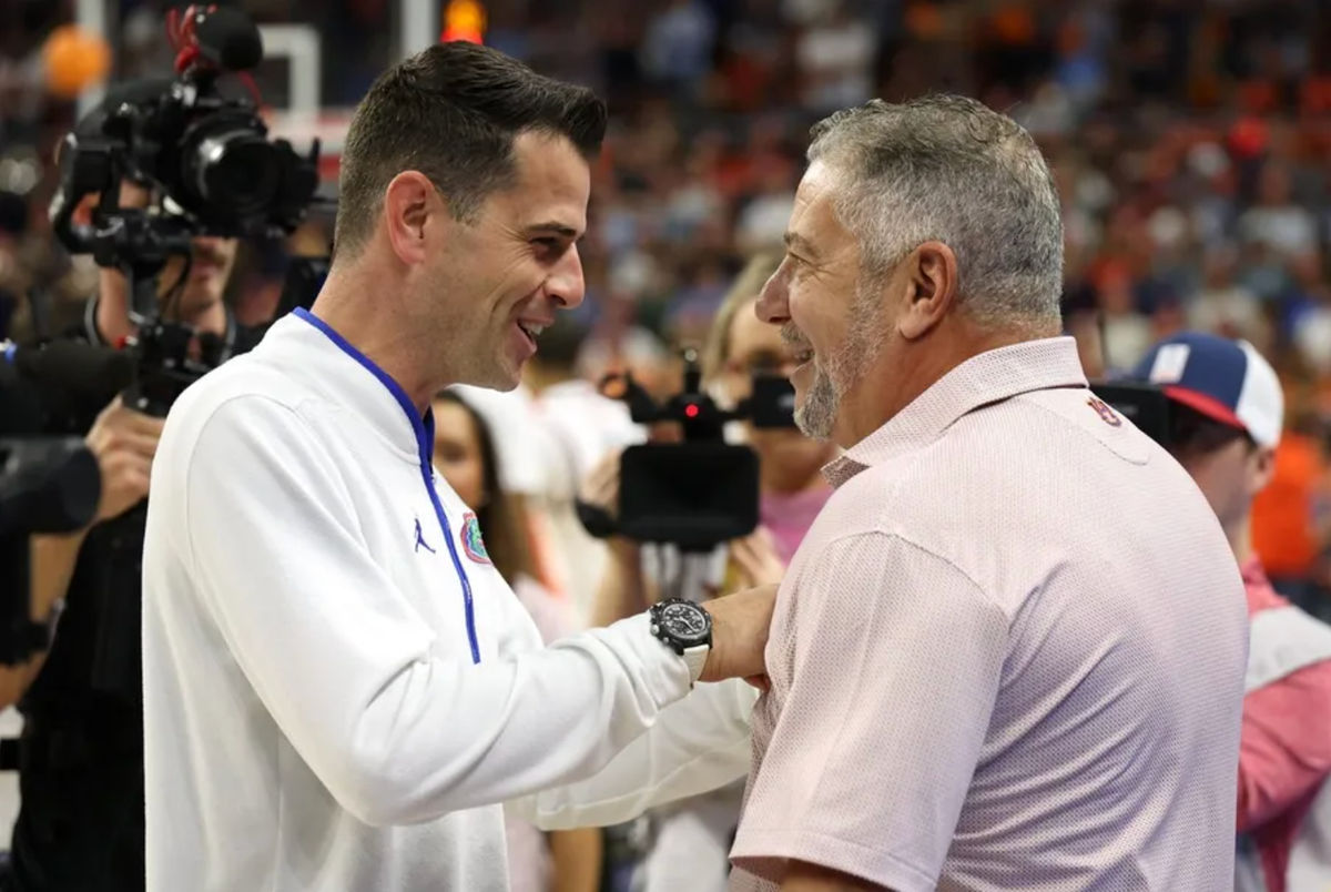 Feb 8, 2025; Auburn, Alabama, USA; Florida Gators head coach Todd Golden talks with Auburn Tigers head coach Bruce Pearl before their game at Neville Arena. Mandatory Credit: John Reed-Imagn Images