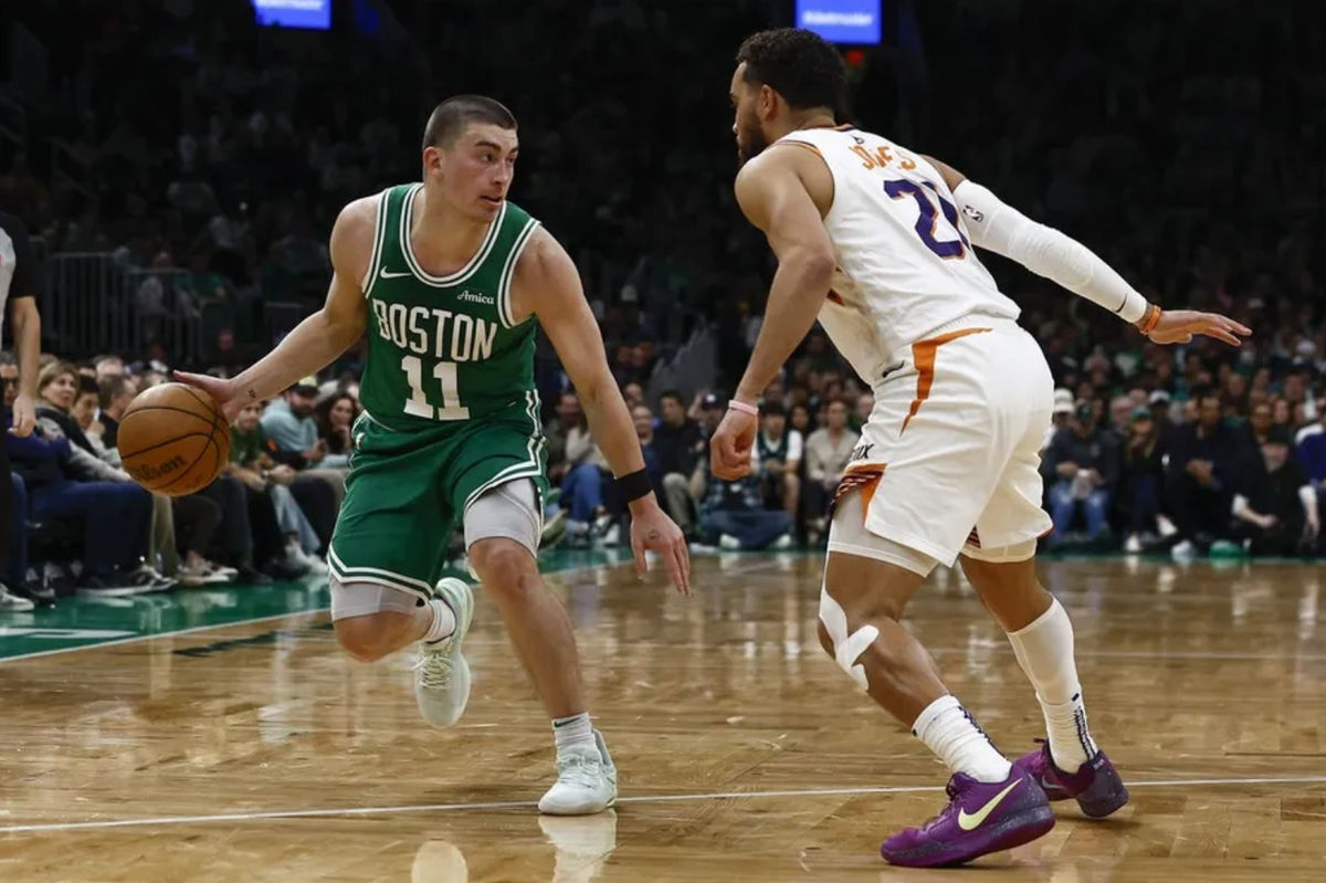 Apr 4, 2025; Boston, Massachusetts, USA; Boston Celtics guard Payton Pritchard (11) looks for an opening around Phoenix Suns guard Tyus Jones (21) during the second quarter at TD Garden. Mandatory Credit: Winslow Townson-Imagn Images