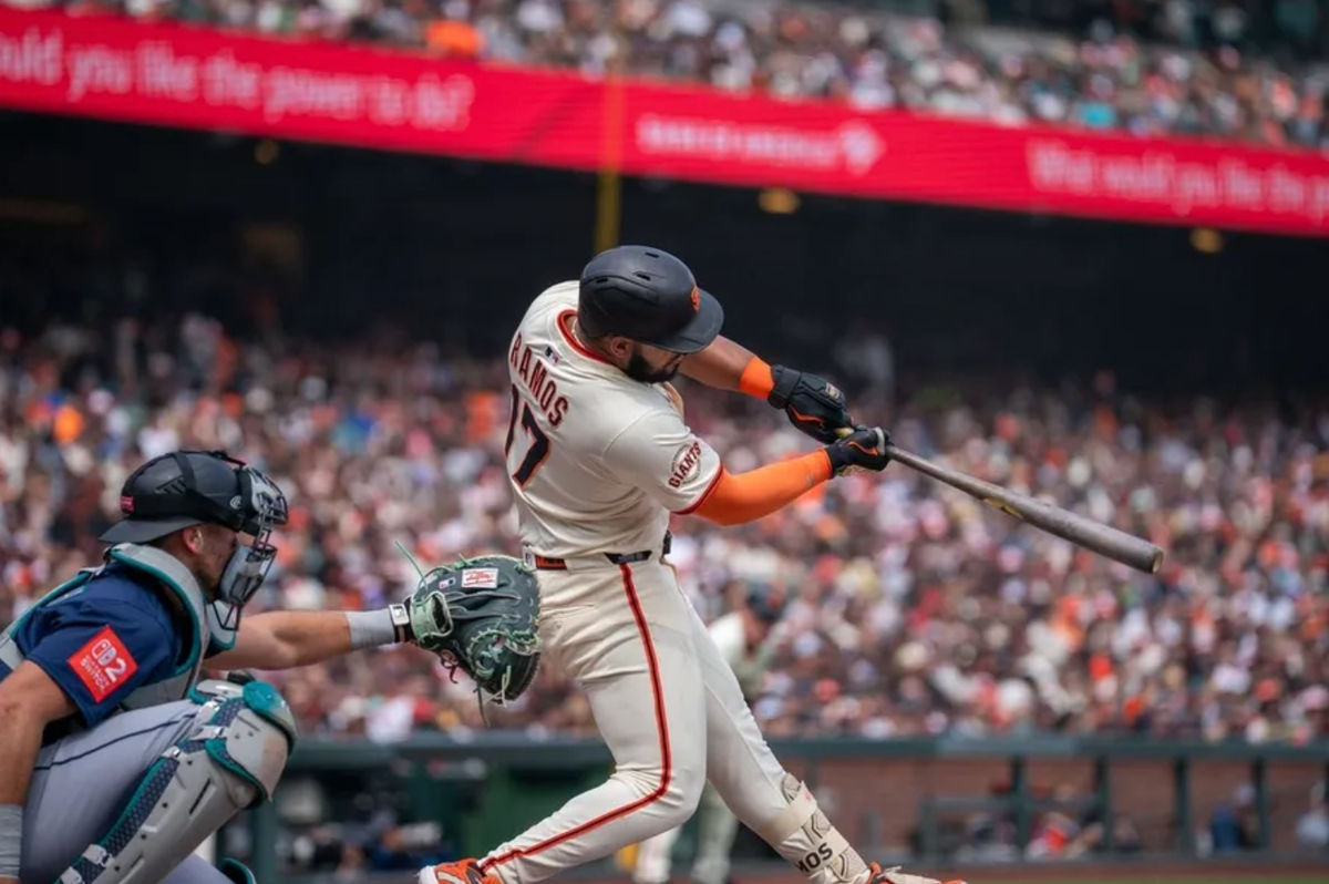 Apr 6, 2025; San Francisco, California, USA; San Francisco Giants designated hitter Heliot Ramos (17) hits a RBI single during the fourth inning against the Seattle Mariners at Oracle Park. Mandatory Credit: Neville E. Guard-Imagn Images