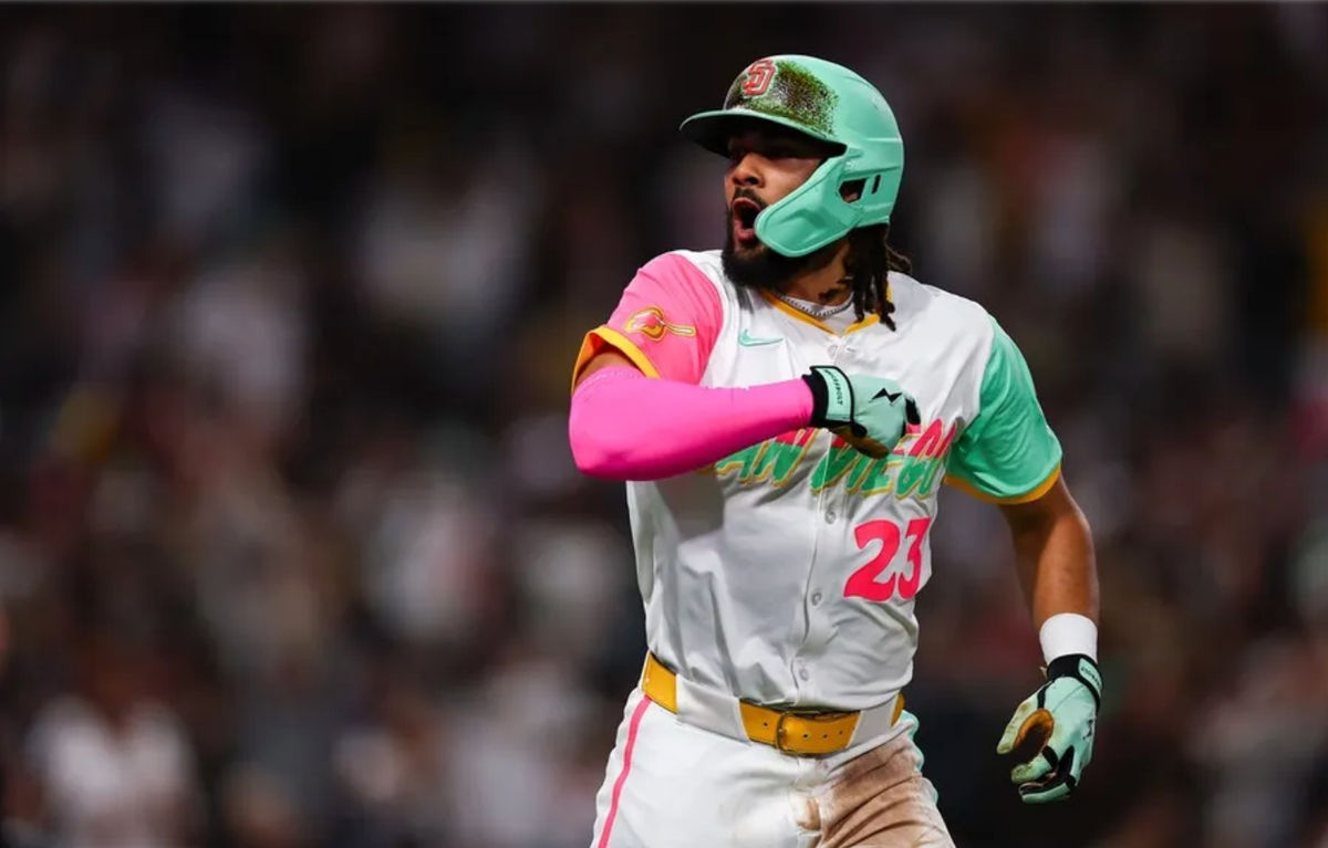 Apr 11, 2025; San Diego, California, USA; San Diego Padres right fielder Fernando Tatis Jr. (23) hits a solo home run in the sixth inning against the Colorado Rockies at Petco Park. Mandatory Credit: Chadd Cady-Imagn Images