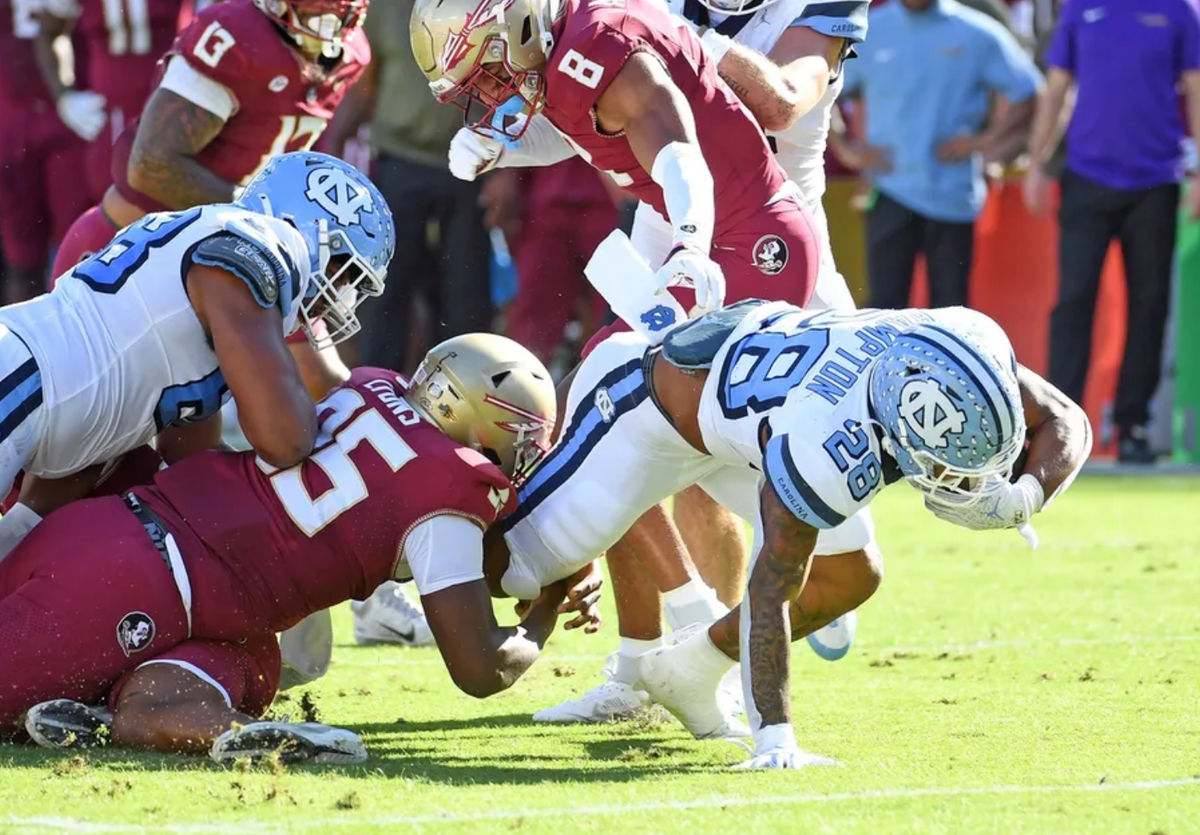 Nov 2, 2024; Tallahassee, Florida, USA; North Carolina Tarheels running back Omarian Hampton (28) runs the ball against the Florida State Seminoles during the first quarter at Doak S. Campbell Stadium. Mandatory Credit: Robert Myers-Imagn Images