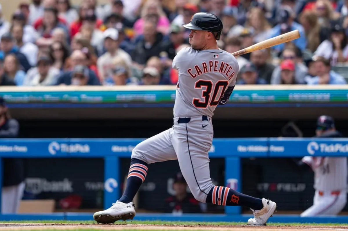 Apr 12, 2025; Minneapolis, Minnesota, USA; Detroit Tigers left fielder Kerry Carpenter (30) hits a single during the first inning against the Minnesota Twins at Target Field. Mandatory Credit: Jordan Johnson-Imagn Images