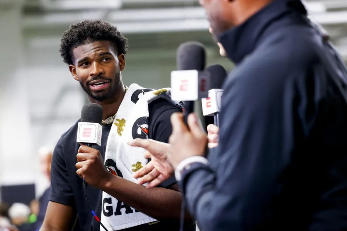 Apr 4, 2025; Boulder, CO, USA; Colorado Buffaloes quarterback Shedeur Sanders (2) talks to ESPN after the University of Colorado NFL Showcase at the CU Indoor Practice Facility. Mandatory Credit: Michael Ciaglo-Imagn Images