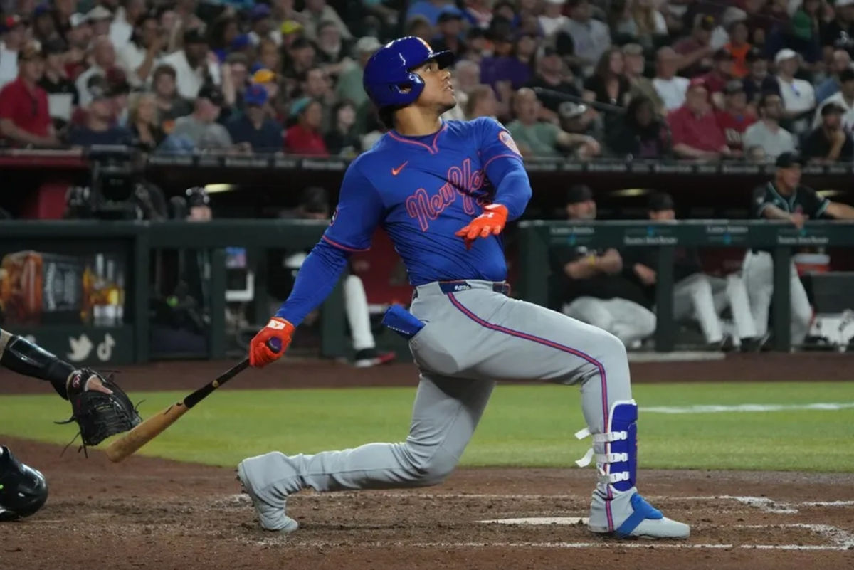 May 7, 2025; Phoenix, Arizona, USA; New York Mets outfielder Juan Soto (22) hits a solo home run against the Arizona Diamondbacks in the sixth inning at Chase Field. Mandatory Credit: Rick Scuteri-Imagn Images