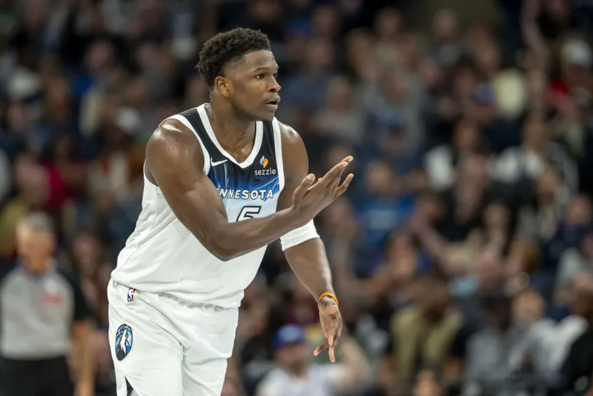 March 9, 2025; Miniapolis, Minnesota, USA; The Minnesota Timbervols Guard Anthony Edwards (5) held his hand by celebrating a three -point shot against San Antonio Sprows in the first half at the Target Center.